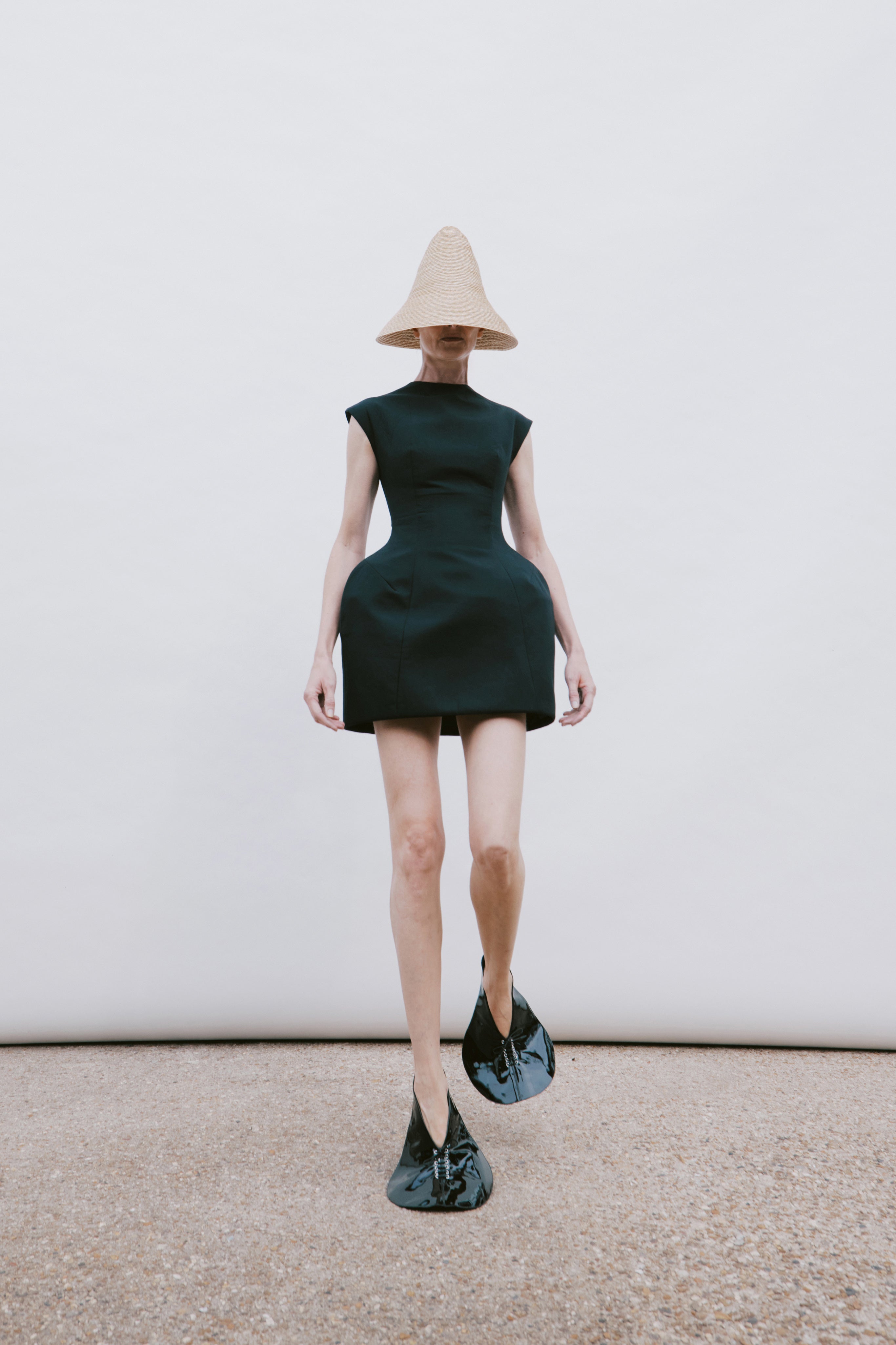 Black sculptural A.W.A.K.E. Mode dress for contemporary black tie dressing