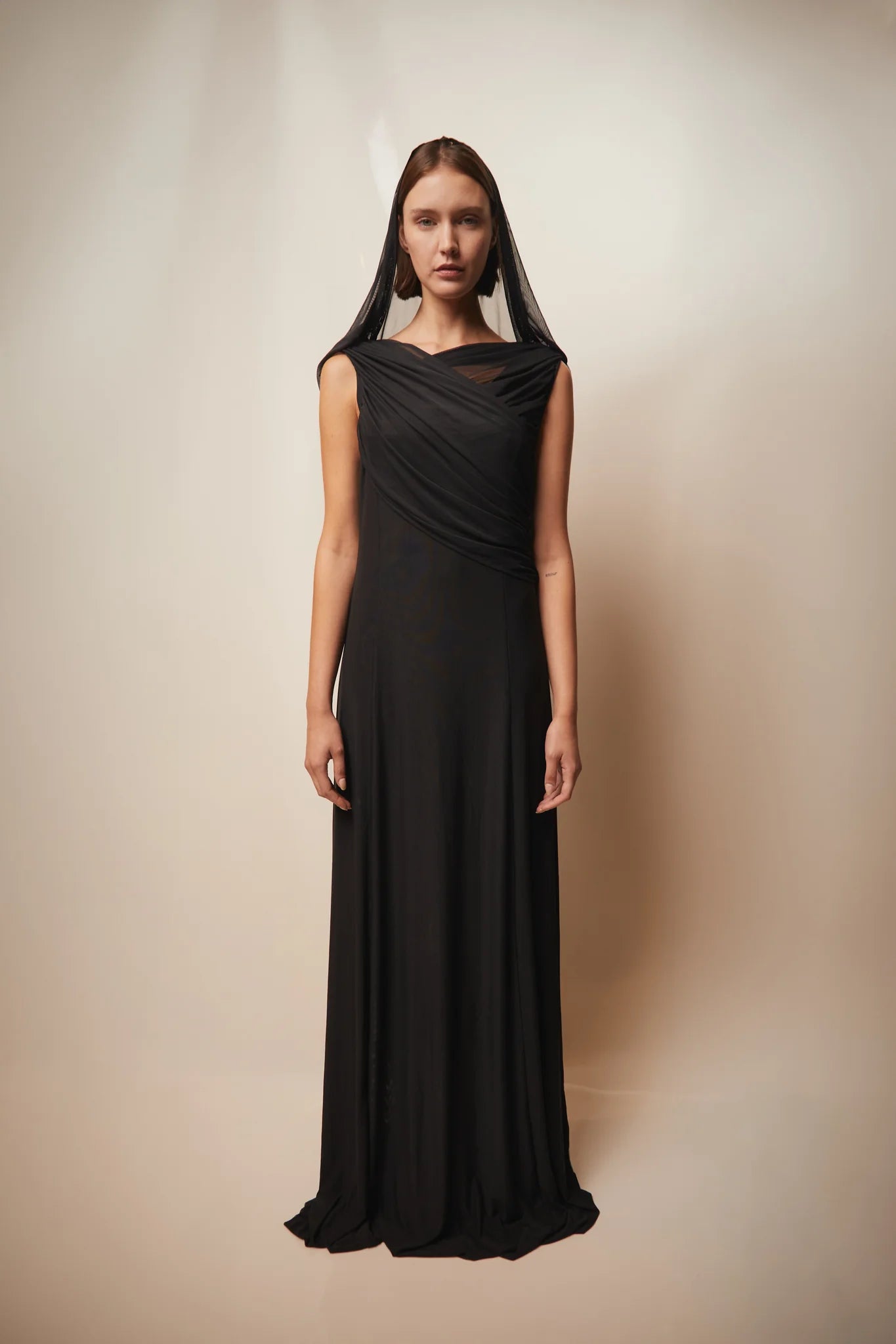 Black Teresa Helbig gown for black tie wedding guest dressing