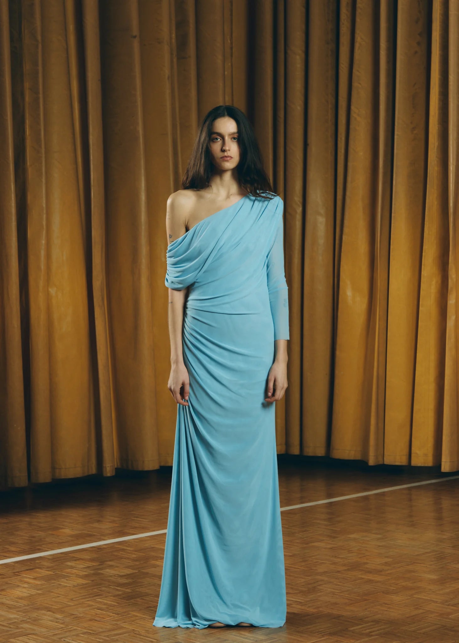 Blue Teresa Helbig draped gown for black tie wedding guest dressing