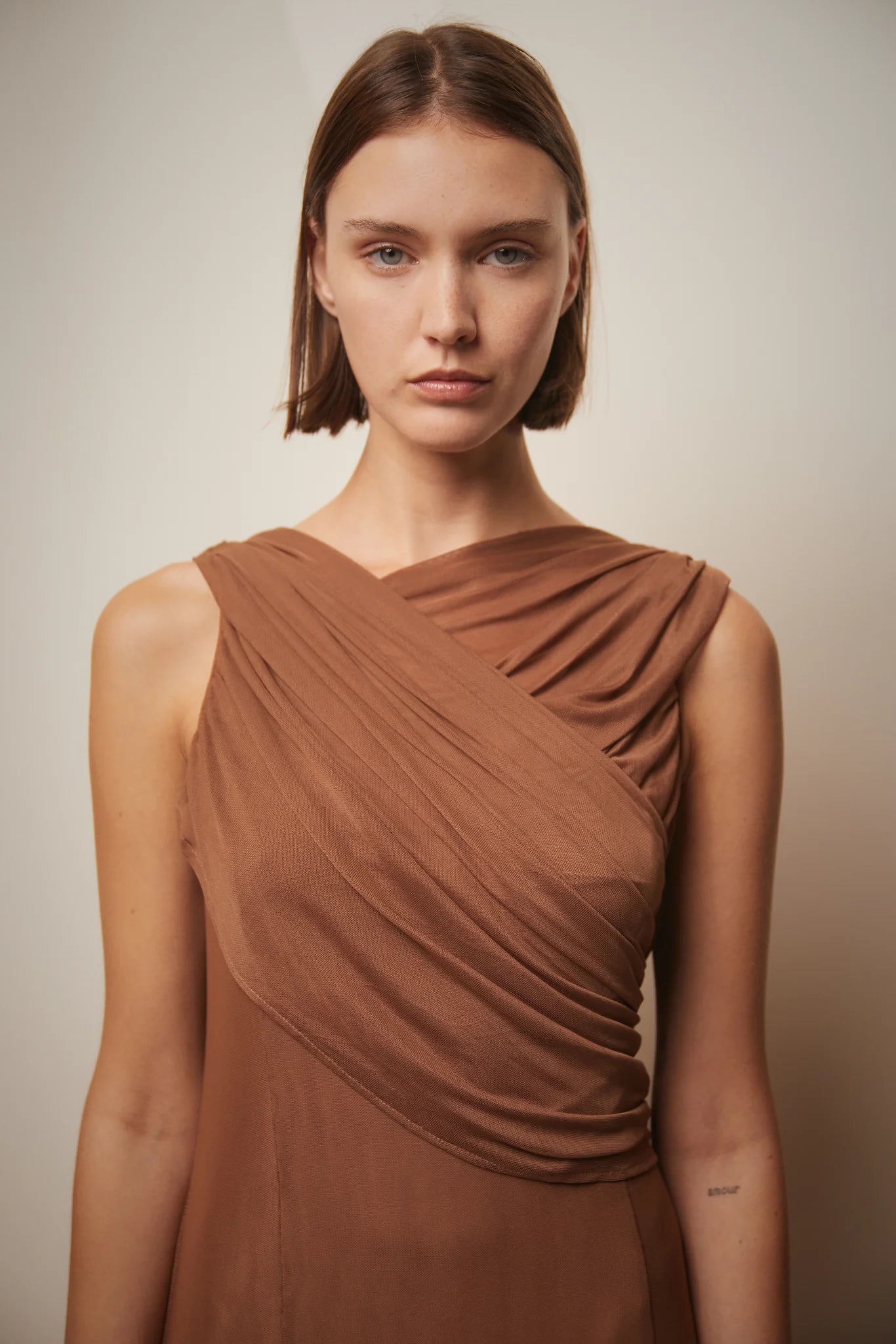 Brown Teresa Helbig draped gown for black tie wedding guest dressing