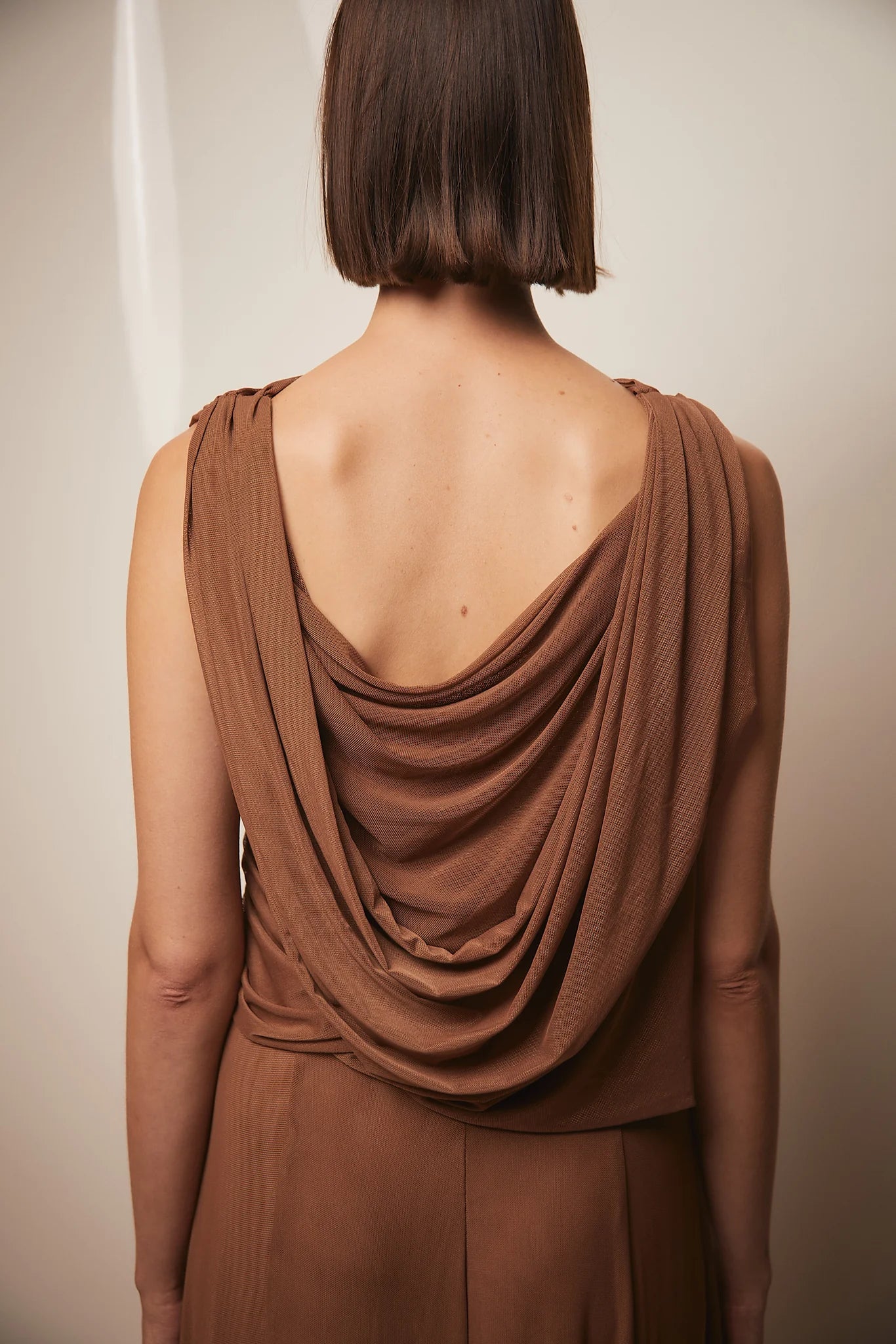 Brown Teresa Helbig draped gown for black tie wedding guest dressing
